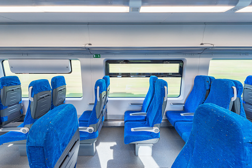 Interior of the empty passenger carriage of the train.