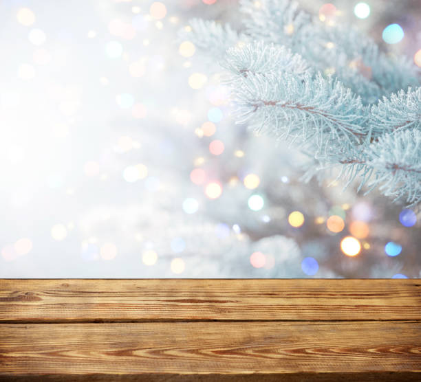 istock Christmas tree branches with wooden background 1273086275