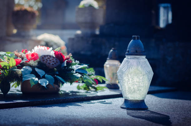 istock white lantern shining at night during All Saints Day in the cemetery 1273092999
