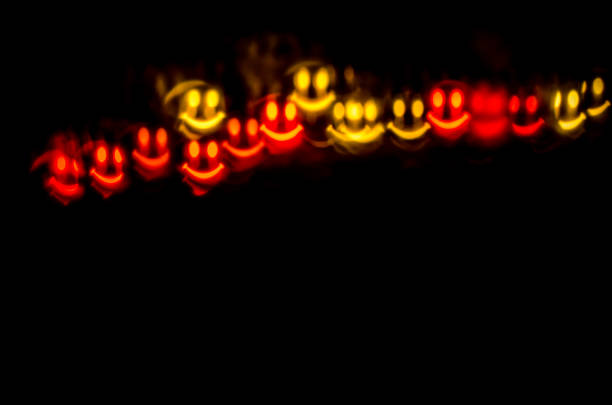 illuminated glittering red smiling emoji  copy space background