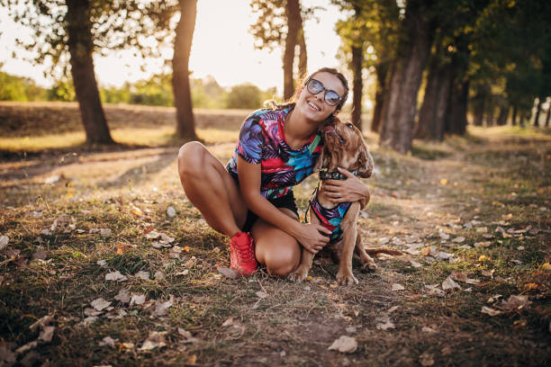 istock Woman cuddling with her cocker spaniel dog in nature 1273099599