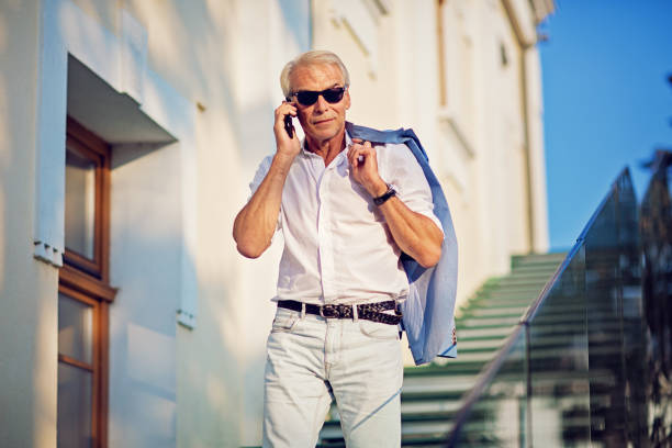 istock Mature man is talking exiting his office 1273123819