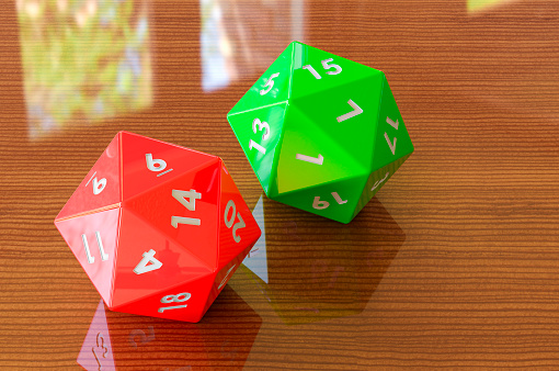 Red twenty-sided die, 20 sides on the wooden table. 3D rendering