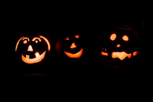 Group of three cheery spooky pumpkins