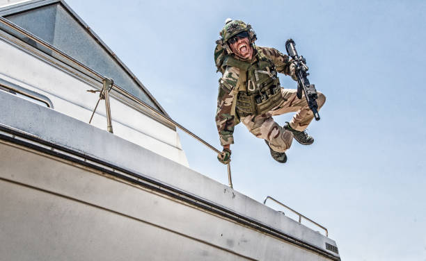 istock Commando fighter landing on shore from speed boat 1273148262