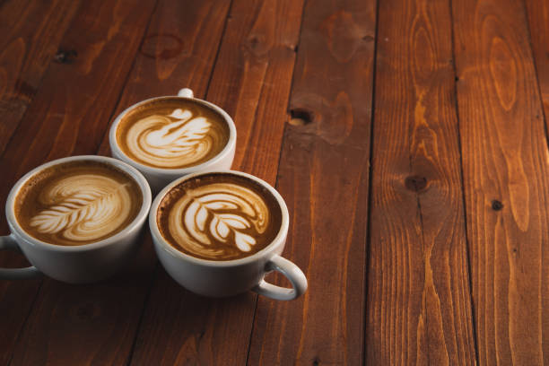 istock Latte art in a coffee cup. from above on a wooden background 1273155462