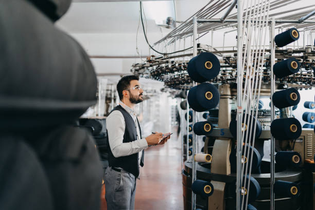 Small Business owner checking the machines performance