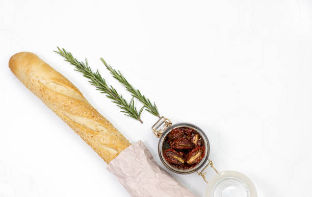 istock baguette dried tomatoes with fresh rosemary on white texture background 1273170020