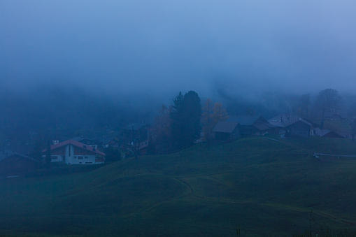 view of a valley in a beautiful early morning with fog between hills