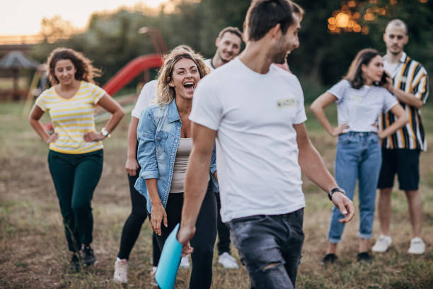 istock Group of young people having fun on team building in nature 1273172332