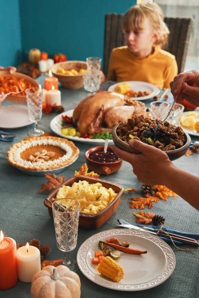istock Family Having Traditional Holiday Stuffed Turkey Dinner 1273172396