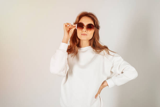 istock Beautiful cheerful confident young woman standing over a white background 1273172485