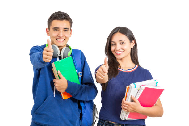 istock Young and happy students studying standing on white background 1273180194