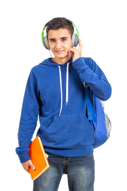 istock Young latin man with his books in hand on white background. 1273180511