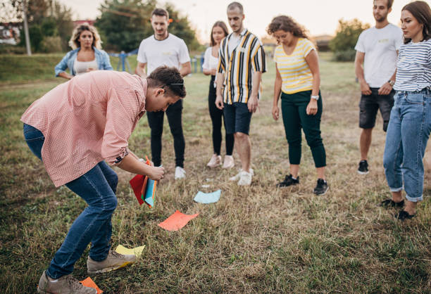 istock Group of friends having fun on team building in nature 1273181790