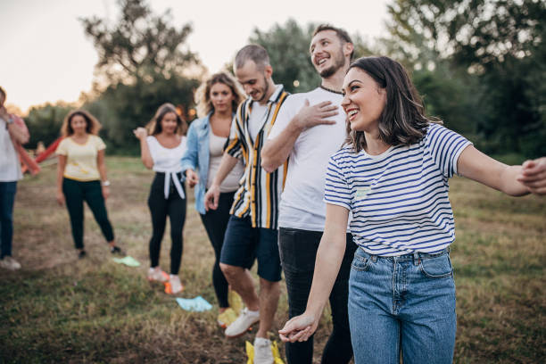 istock Group of friends having fun on team building in nature 1273184352