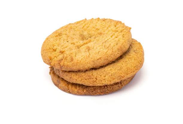 istock Delicious and toasted vanilla cookies on white background. 1273191494