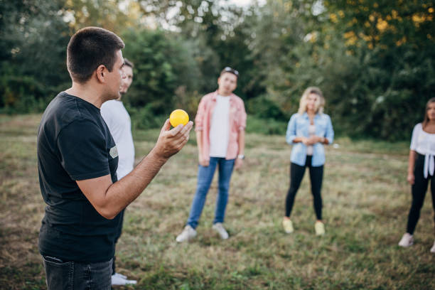 istock People making team training exercise during team building seminar outdoors 1273193219