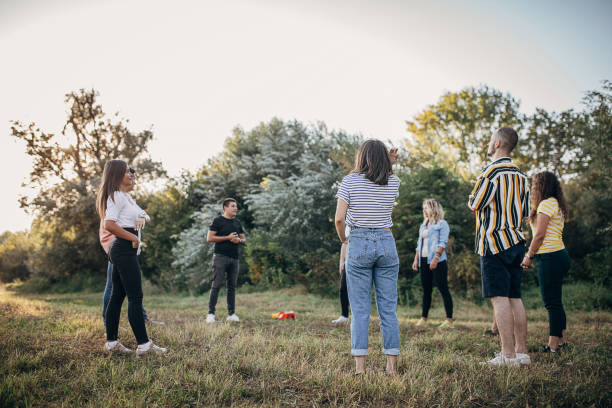 istock Young people on a team building seminar outdoors 1273194098