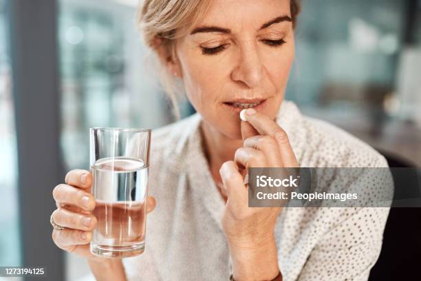 This Aspirin Should Take Care Of My Headache Stock Photo - Download Image Now - Women, Taking Medicine, Pill
