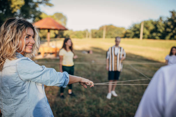 istock Young people playing games on a team building seminar 1273194613