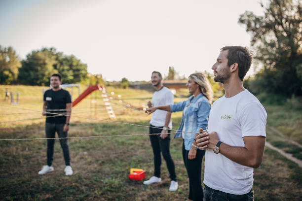 istock Creative people playing games on a team building seminar 1273194658