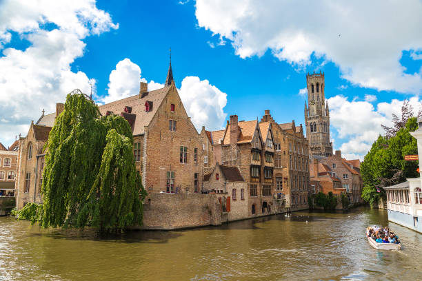 istock Canal in Bruges and Belfry tower 1273197011