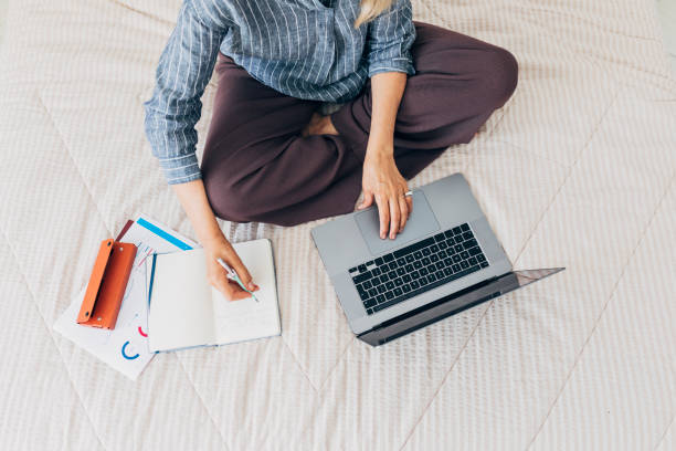 istock Anonymous Businesswoman Working from Home, an Overhead View 1273197967
