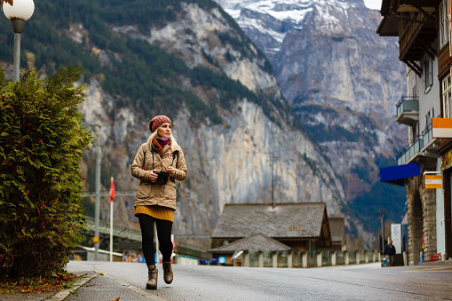 girl on a rural road in switzerland near the mountain jungfrau