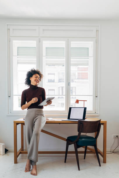 istock African American Businesswoman Using a Digital Tablet to Work from Home (Copy Space) 1273200177