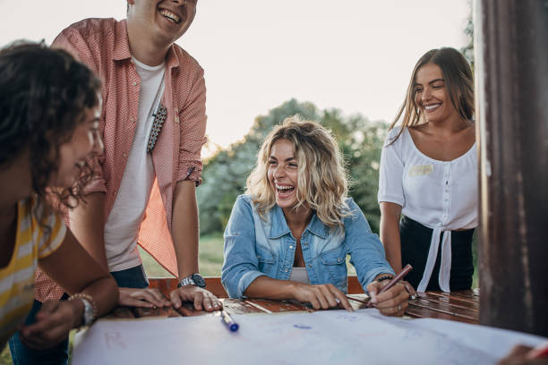 istock Cheerful people on a team building meeting outdoors at public park 1273204706