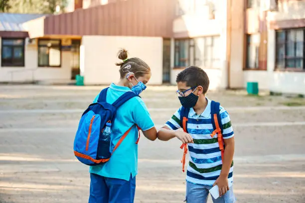 Photo of Back To School - Boys Greeting With Elbow Bump