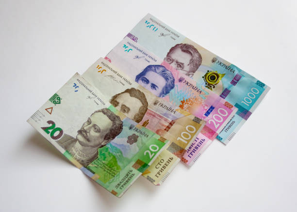 istock Ukrainian hryvnia banknotes on white background 1273204904