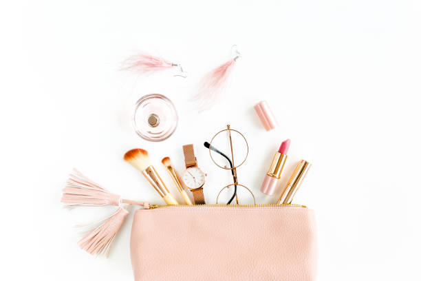 istock Flat lay composition with pink cosmetic bag with cosmetic makeup products, isolated on white background. Flat lay, top view 1273205843