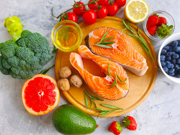 istock fresh salmon, tomato on concrete background 1273207349
