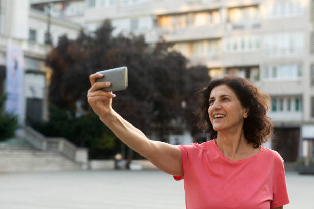 istock Senior woman taking a selfie 1273208441