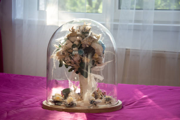 istock bridal bouquet in glass globe 1273211330