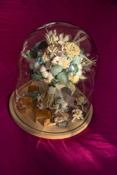 istock bridal bouquet in glass globe 1273211331