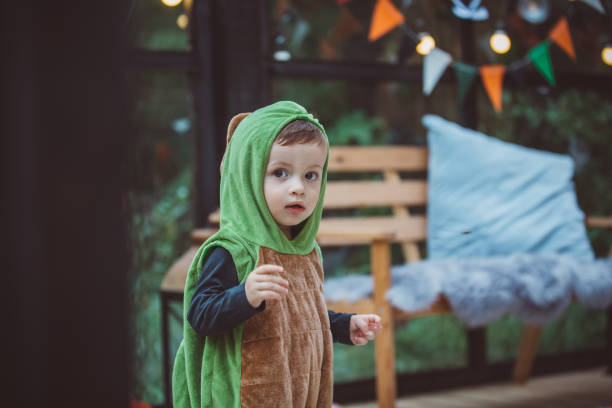 istock Baby boy in dinosaur costume 1273212516