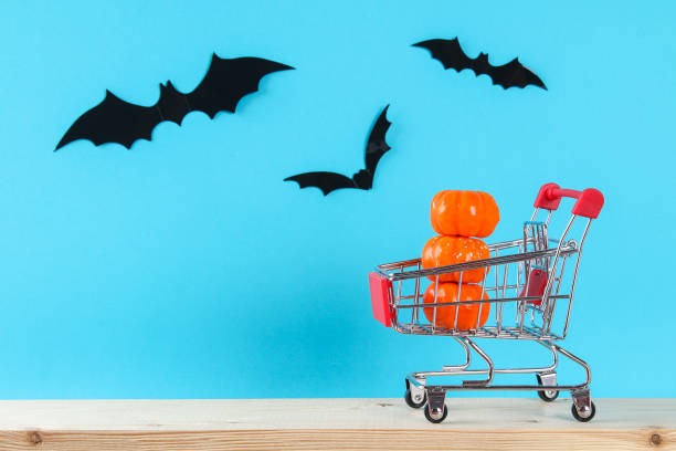istock Halloween holiday concept with pumpkin decor on wooden table. 1273212716