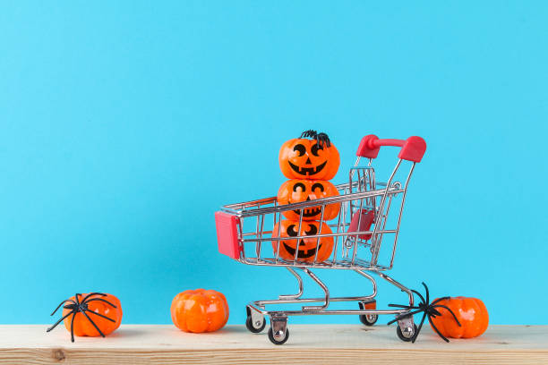 istock Halloween holiday concept with pumpkin decor on wooden table. 1273212728