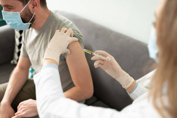 istock Man receiving a vaccine on his arm 1273213663
