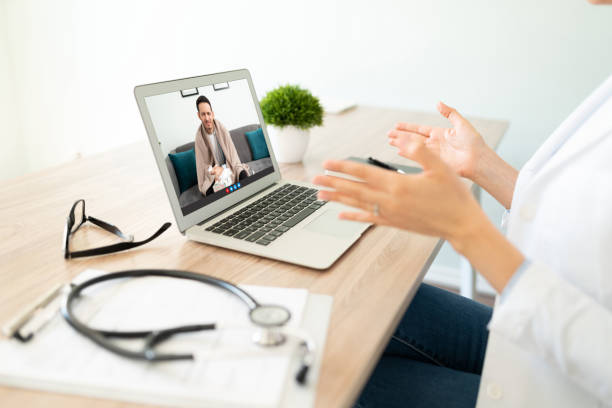 istock Female doctor seeing a patient online 1273213825
