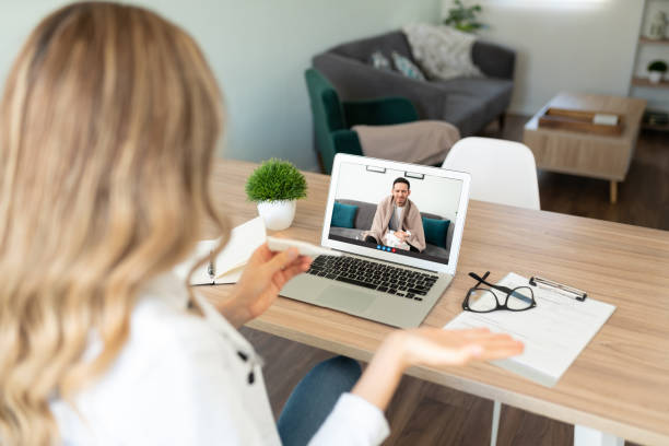istock Doctor working from home and talking to patient 1273213891