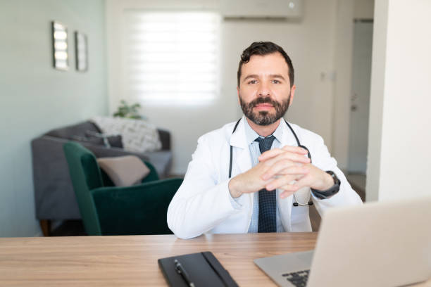 istock Male physician working from home 1273214526