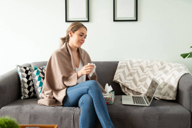 istock Sick woman seeing doctor in a video call 1273214574