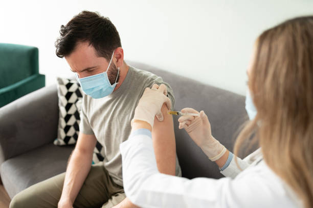 istock Doctor applying a vaccine on patient 1273214602