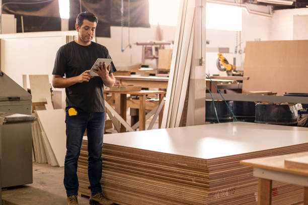 istock Carpenter at the carpentry holding a digital tablet 1273215467