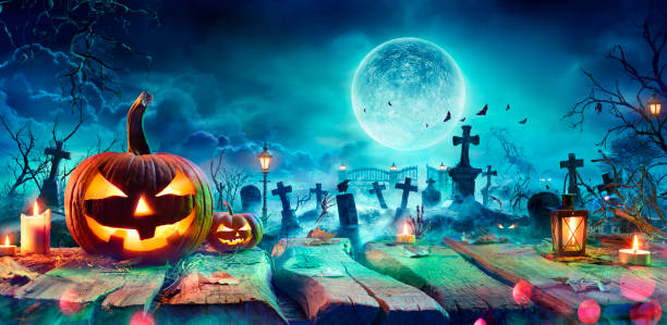 istock Jack O’ Lantern On Table In Spooky Graveyard At Night - Halloween With Full Moon 1273218016