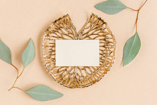 istock Mockup invitation, blank greeting card and green leaves eucalyptus. Flat lay, top view 1273219672